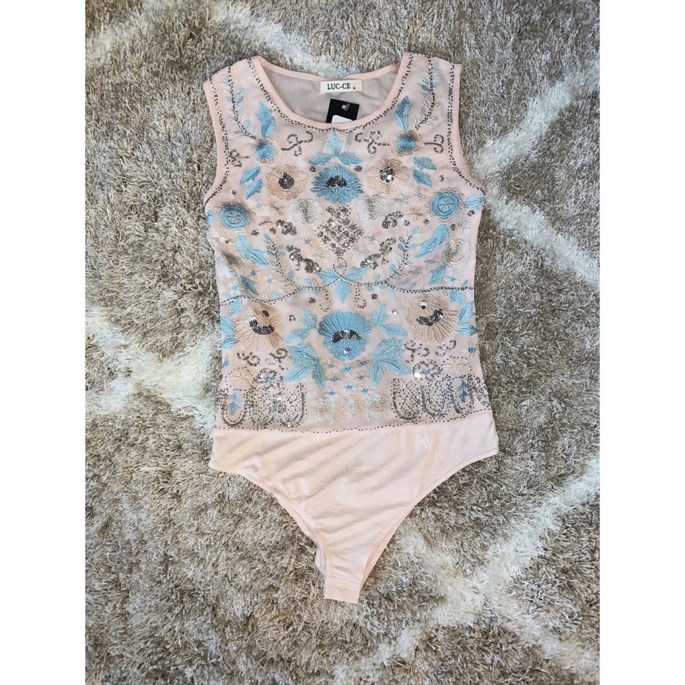 Embroidered light pink bodysuit